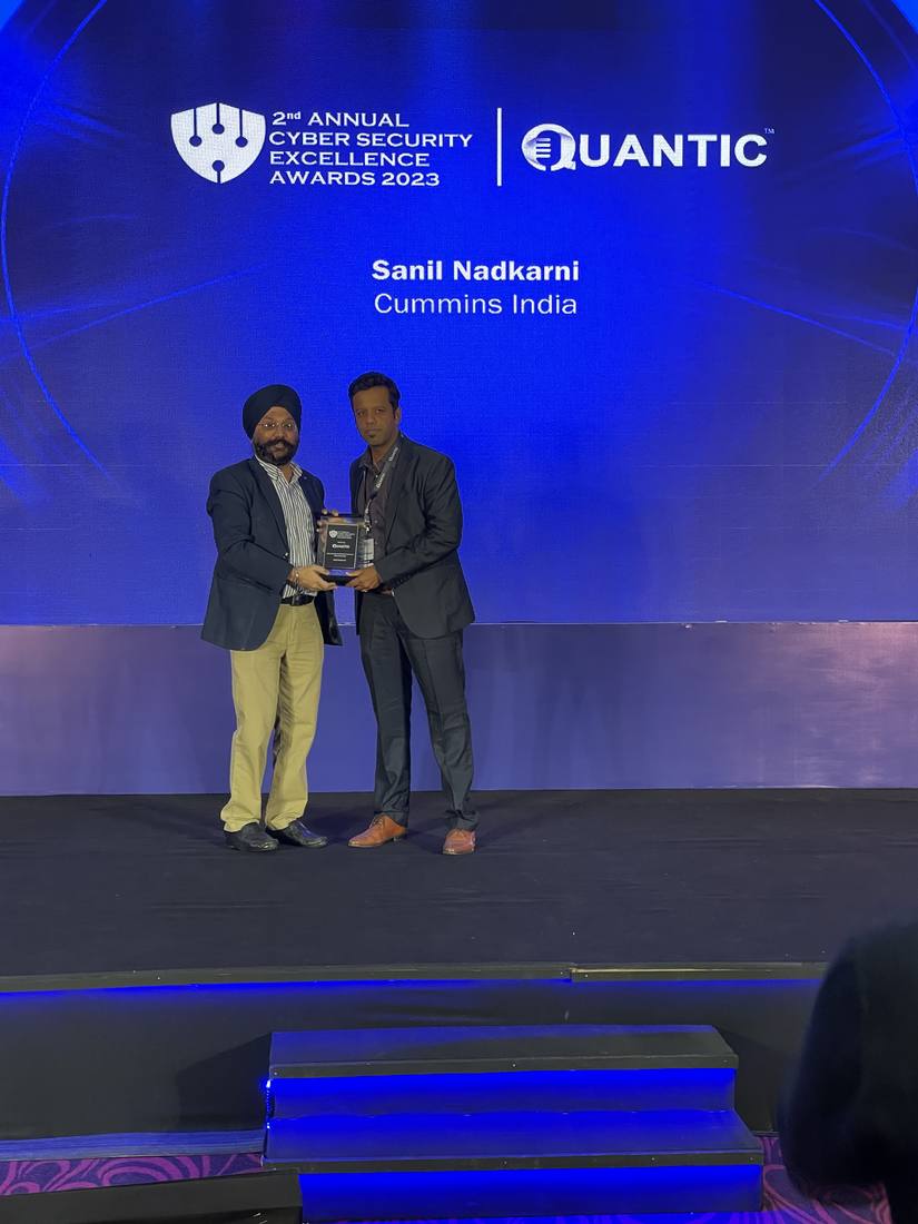 Sanil Nadkarni receiving the Cyber Security Excellence Award on stage